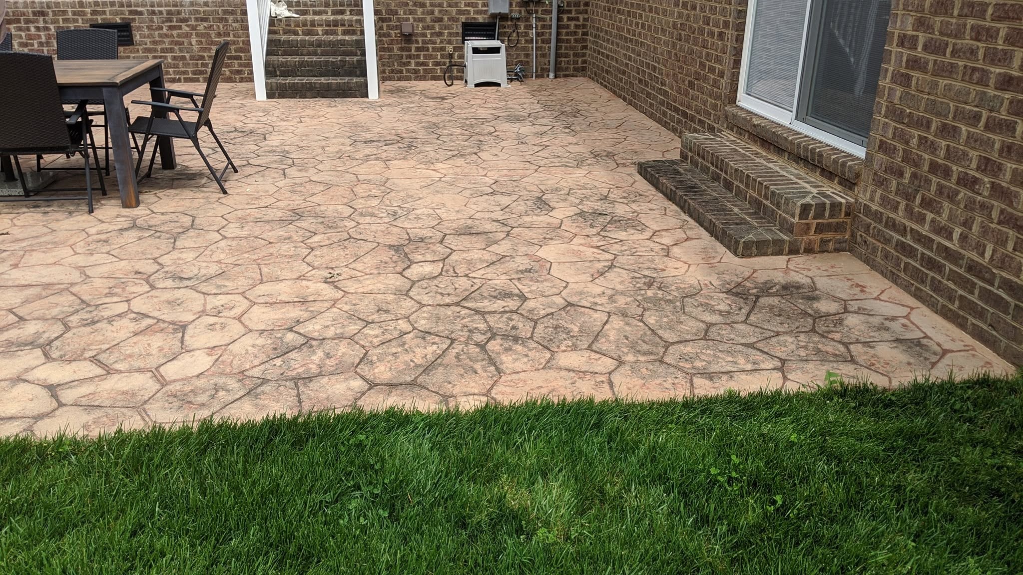 Stamped Concrete Patio — Before Pressure Wash
